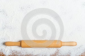 Sifted flour and rolling pin on the table