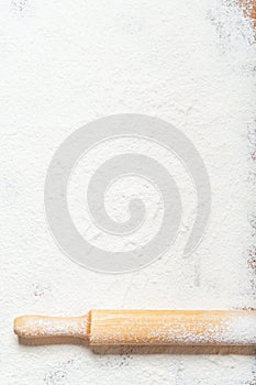 Sifted flour and rolling pin on the table