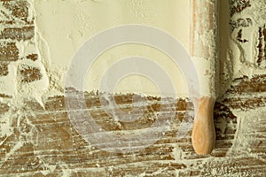 Sifted flour and rolling pin on the table