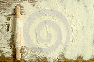 Sifted flour and rolling pin on the table