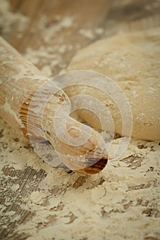 Sifted flour on the table and a rolling pin