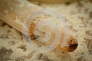 Sifted flour on the table and a rolling pin