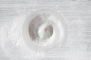 Sifted flour on the wooden table