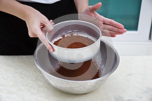 Sifting cocoa powder