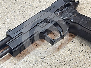 Sig Sauer P226 replica handgun cocked