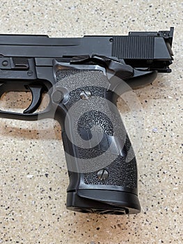 Sig Sauer P226 replica handgun cocked