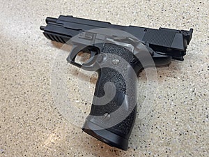 Sig Sauer P226 replica handgun cocked