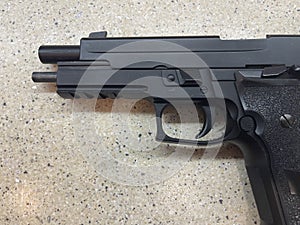 Sig Sauer P226 replica handgun cocked