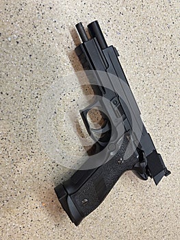 Sig Sauer P226 replica handgun cocked