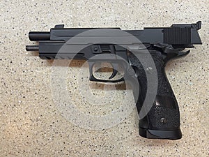 Sig Sauer P226 replica handgun cocked