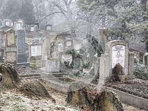 Sighisoara Romania - 11.26.2020: Graves and tombstones in the cemetery located near Church on the Hill in Sighisoara