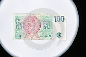 Sight on 100 Czech crowns banknote closeup reverse