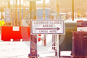 Sight sidewalk closed ahead cross here in Chicago