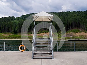 Empty Lake of Youth beach in Bukovel in summer