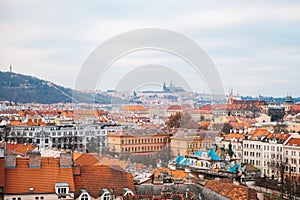 Beautiful view of the center of Prague - old buildings of the roof of red tiles