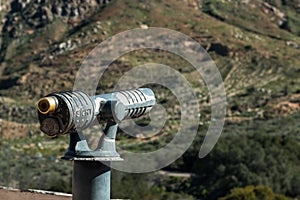 Sightseeing Binoculars Pointed Right Towards Mountain.
