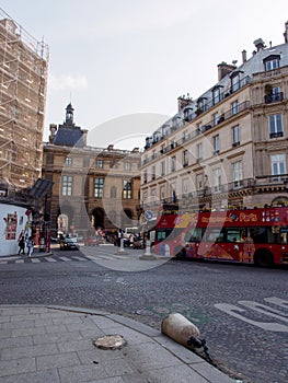 Sightseeing buse at cobbled road near Place du Carrousel, Paris, France