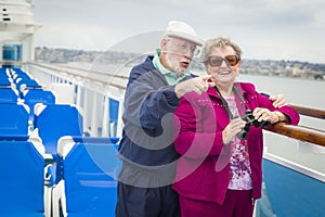 Sightseeing Senior Couple on The Deck of a Cruise Ship