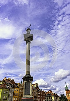 Sigismund`s Column in Castle Square with vintage architecture of Old Town in Warsaw, Poland
