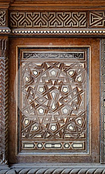 Sigle arabesque sash of an old mamluk era cupboard with geometrical decorations, Cairo, Egypt photo