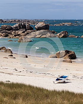 Sigle boat on the beach of Brittany shore in France