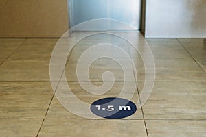 Sign of 1.5 meters on the floor near the elevator, observing the social distance, covid-19, coronovirus concept