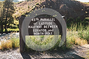 Sign - 45th Parallel of Latitude Halfway between Equator and North Pole sign in the North Entrance of Yellowstone National Park