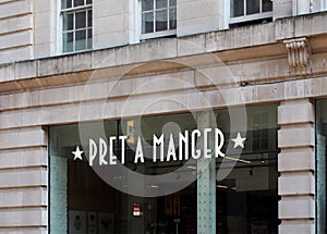 Sign above a pret a manger cafe and takeaway sandwich shop in manchester city centre