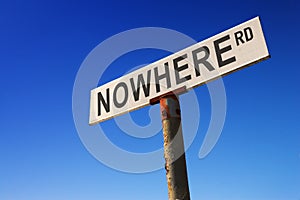 Sign against blue sky