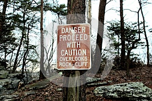 Sign alerting hikers of rock fall danger.