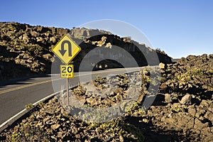 Sign along a curve in a road.