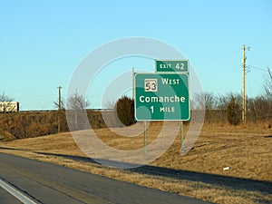 Sign along Interstate Highway 35 with distance to Comanche, Oklahoma City