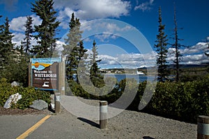 Sign along the Yukon River welcoming visitors to Whitehorse