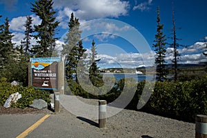 Sign along the Yukon River welcoming visitors to Whitehorse photo