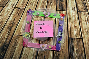 Sign ,,Back to school` in the photo frame