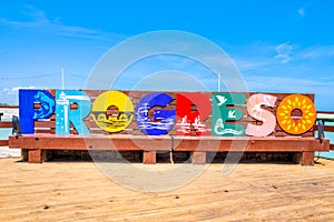 Sign at the beach of Progreso near Merida on a sunny summer day photo