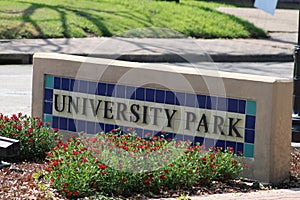 A Sign in beautiful tile marks the entrance to Univeristy Park, part of the Park Cities.