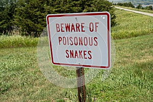 Sign - Beware of Poisonous Snakes, warning hikers of danger