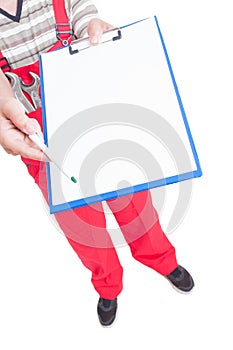 Sign blank papers on clipboard handing by mechanic