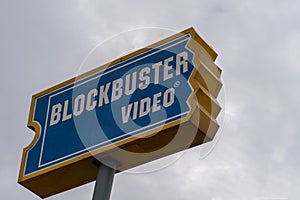 Sign for Blockbuster Video movie rental store. Close up view, overcast day