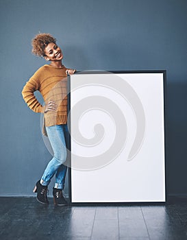 Sign, board and copyspace being held by a beautiful young woman for an advert. Attractive, smiling and happy female