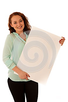 Sign board. Woman holding big white blank card. Positive emotion