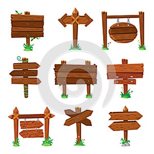 Sign boards in green grass. Wooden plank road signs, wood signboard or isolated signpost board cartoon vector set