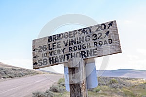 Sign from the Bodie Ghost Town road, giving drivers directions to local towns of Lee Vining, Hawthorne and Bridgeport California photo