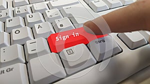 Sign in button on a computer keyboard.