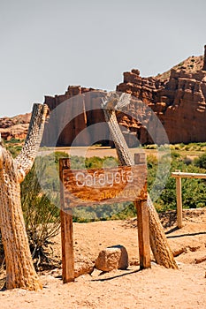 Sign for Cafayate surrounded by dead, dried cactus near Cafayate, Salta, Argentina