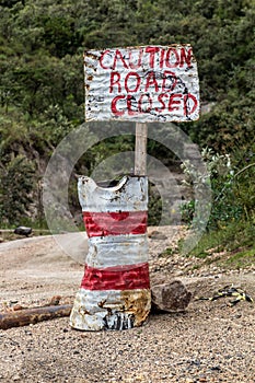 Sign caution road closed in the Hell's Gate National Park, Ken