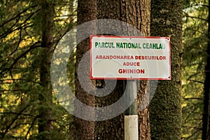 A sign in Ceahlau National Park that says: `Abandonment of waste brings bad luck`