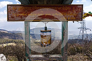 Sign of the the Chelela Highest Point and a prayer wheel, Bhutan, Asia
