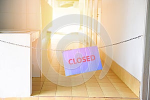 Sign closed hang on walkway in the Public toilet for cleaning No entry Closed for repairs damaged malfunctioning toilet
